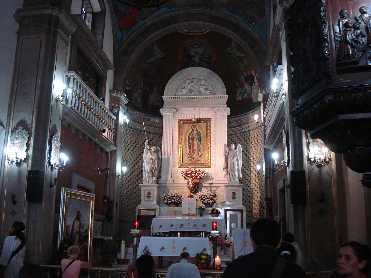 Interior of the Basilica of Guadalupe showing the tilma traditionally identified as Juan Diego’s cloak displayed above the main altar.