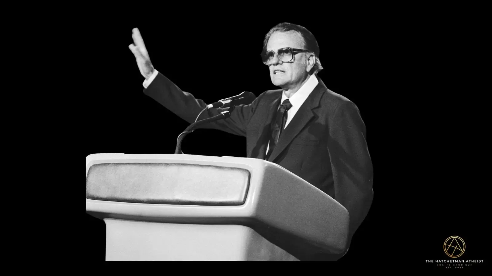 Billy Graham preaching from a pulpit during a mid twentieth century evangelistic crusade